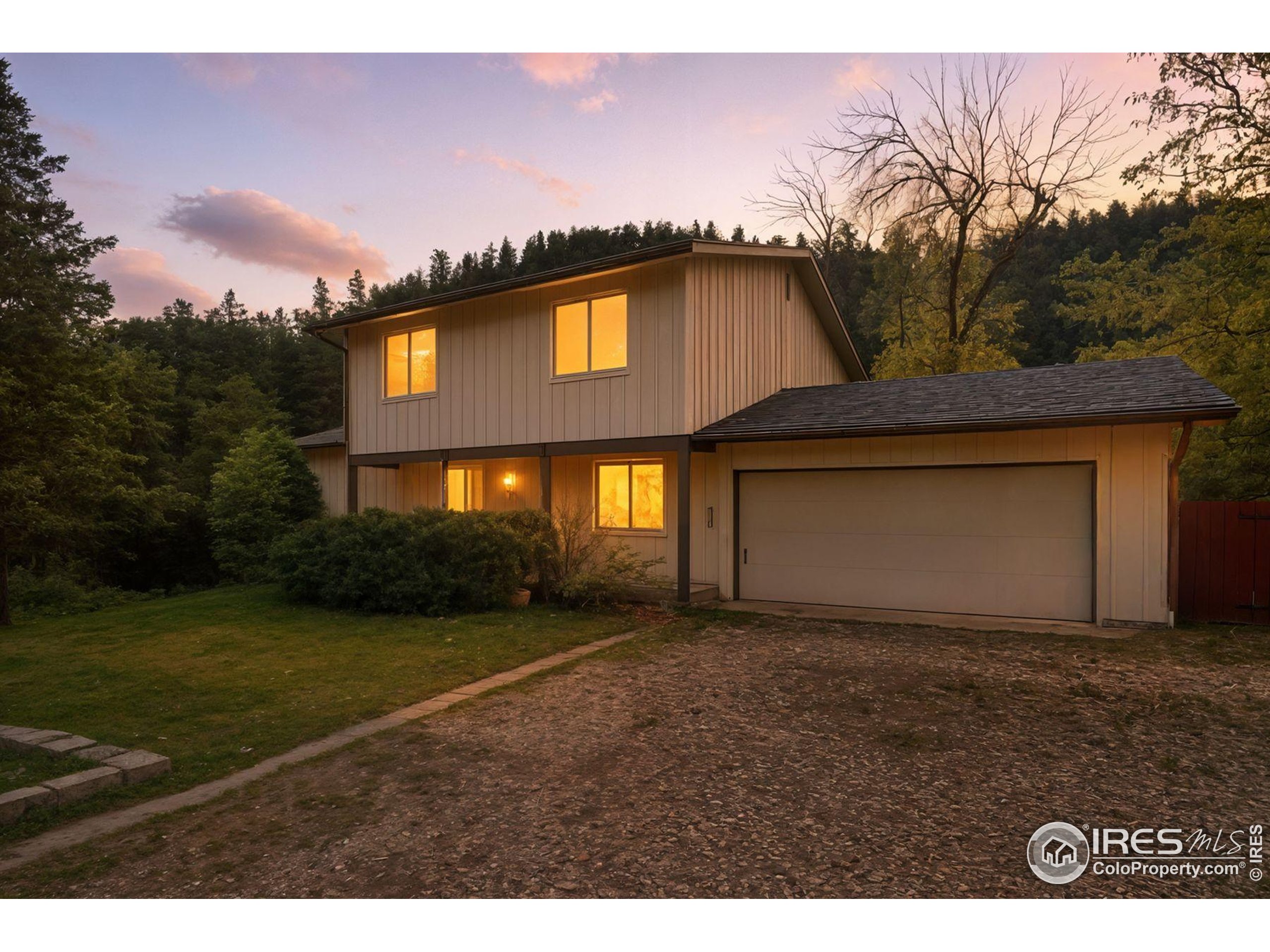 1037 Wagonwheel Gap Road Boulder, CO 80304 - Photo 2 of 43 a front view of a house with a yard