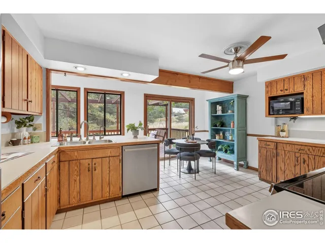 a open kitchen with stainless steel appliances granite countertop a sink and cabinets