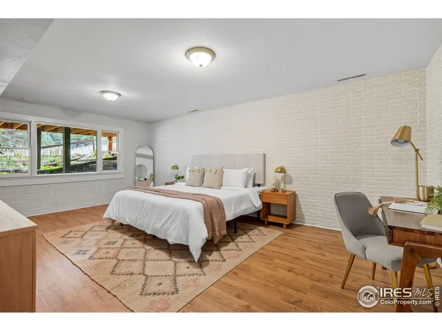 a bedroom with a bed and a chair