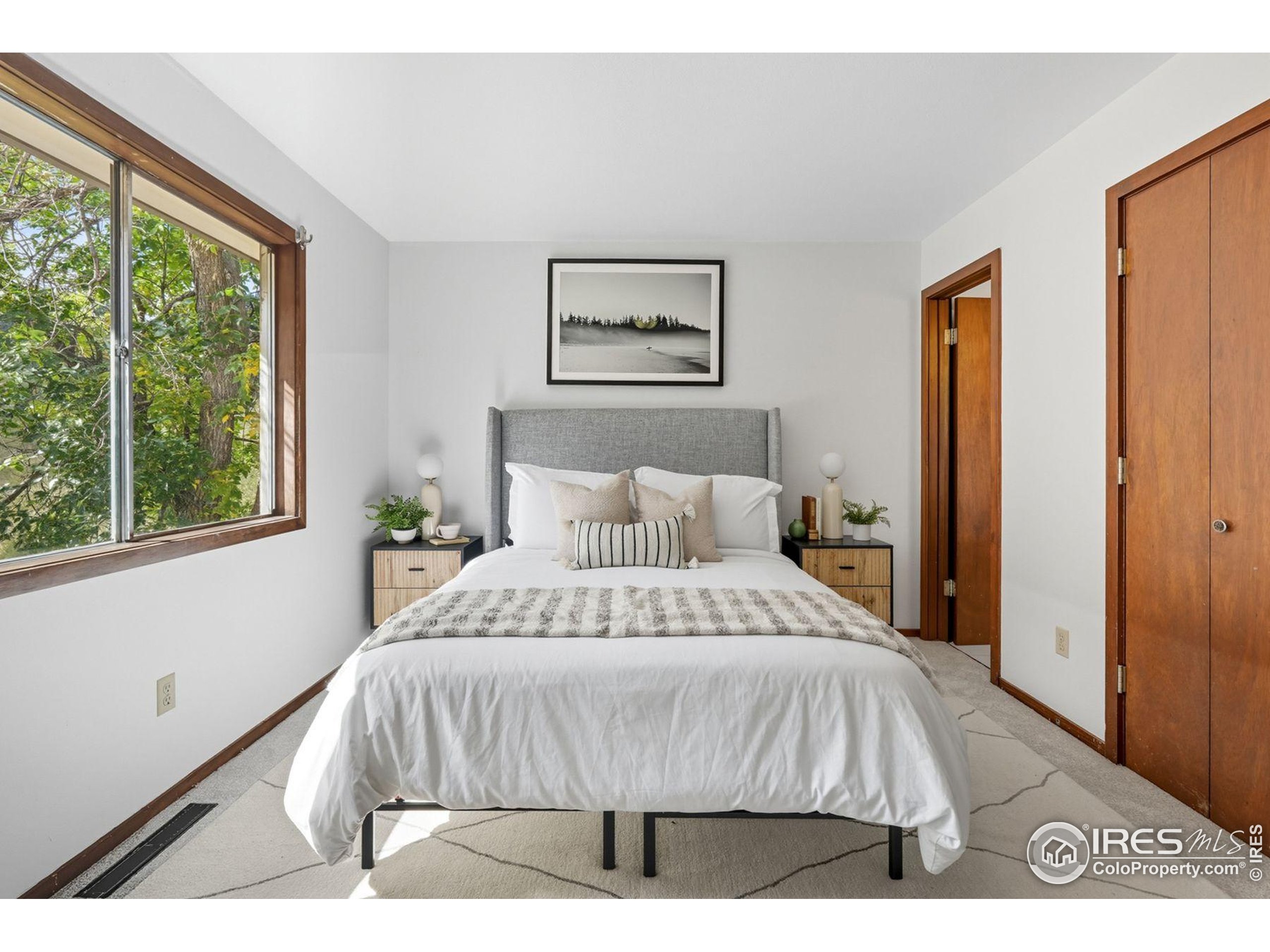 1037 Wagonwheel Gap Road Boulder, CO 80304 - Photo 33 of 43 a bedroom with a bed and a large window