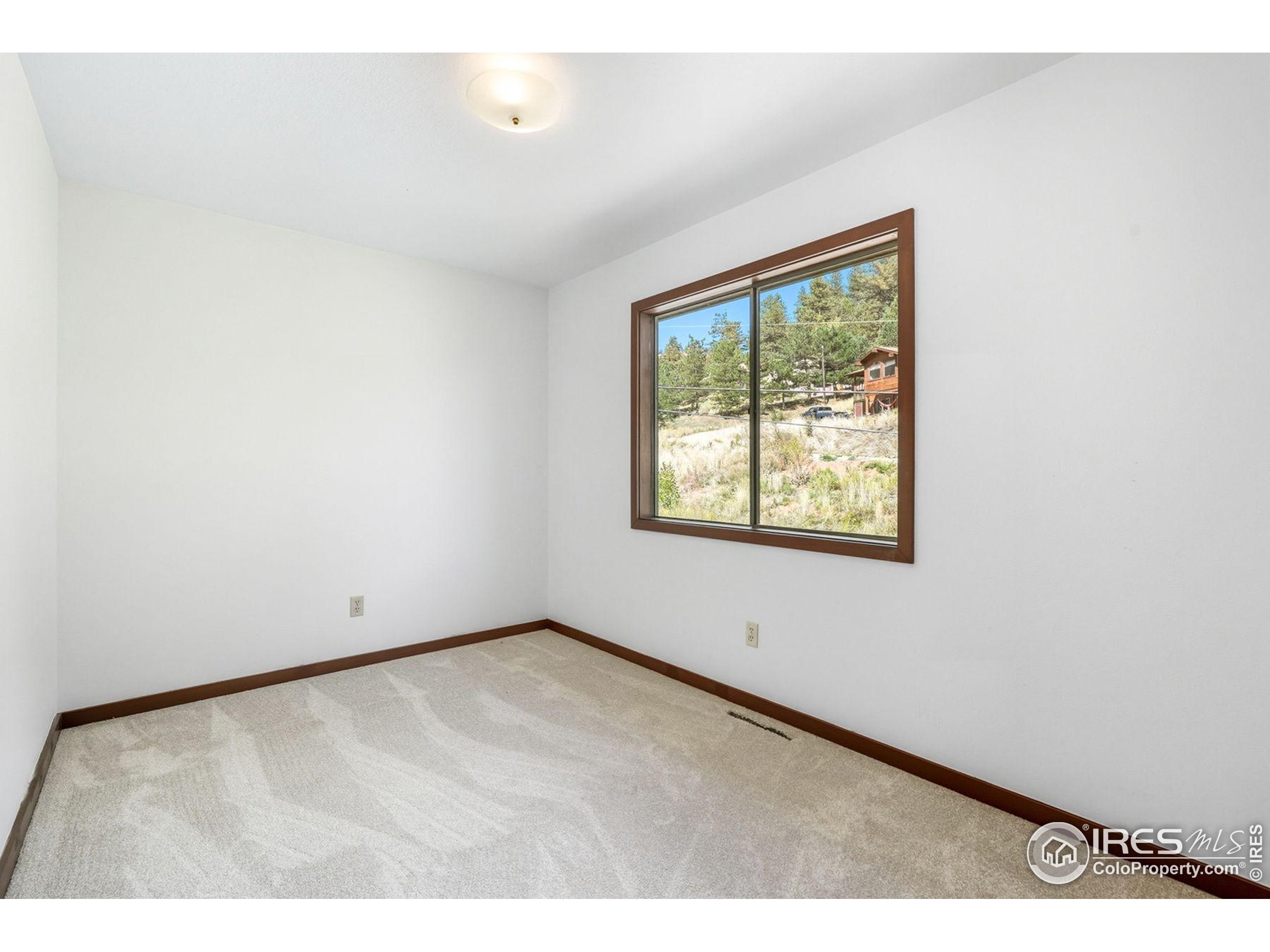 1037 Wagonwheel Gap Road Boulder, CO 80304 - Photo 37 of 43 a view of an empty room with a window
