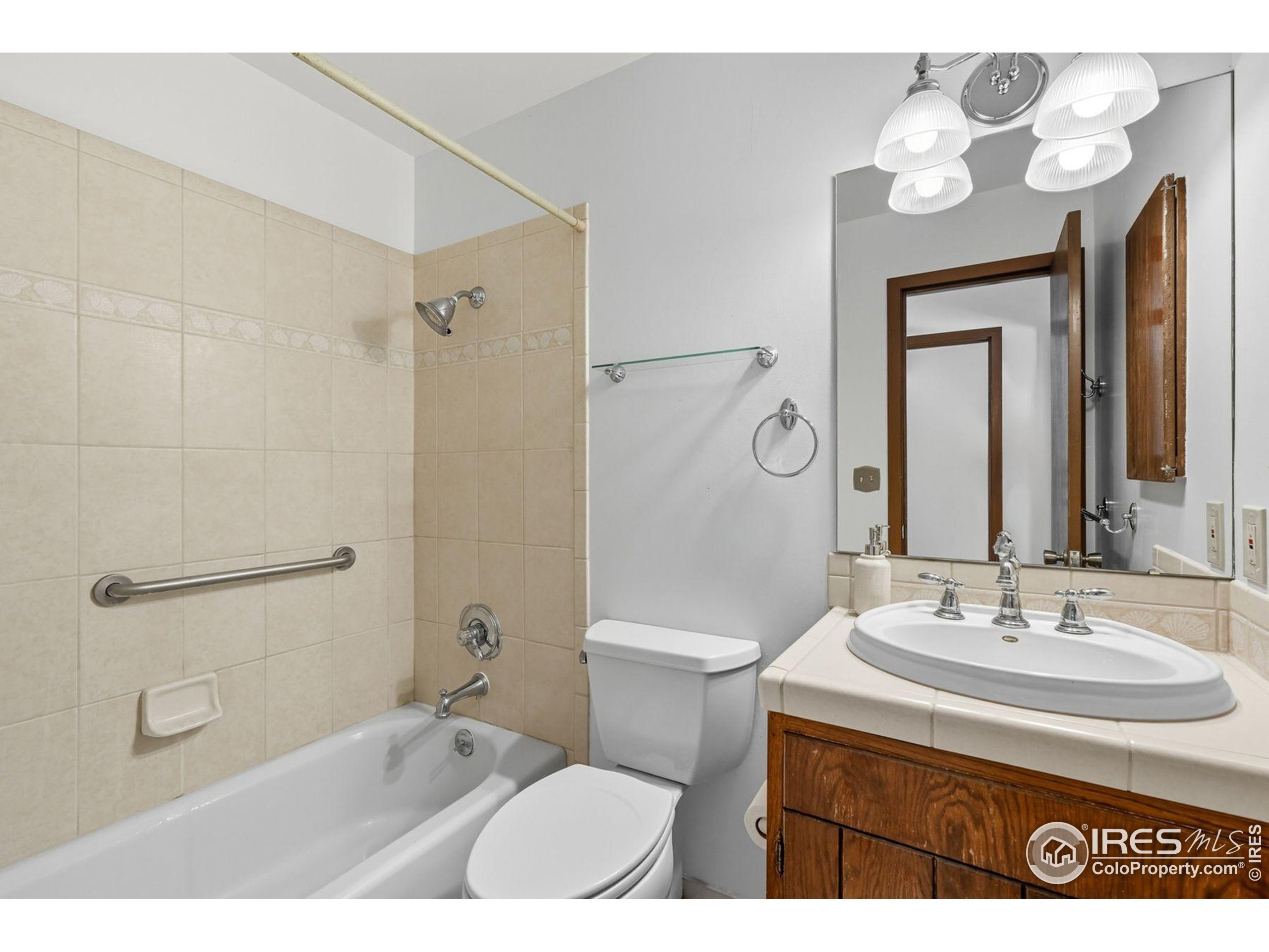 1037 Wagonwheel Gap Road Boulder, CO 80304 - Photo 39 of 43 a bathroom with a sink a toilet and a mirror
