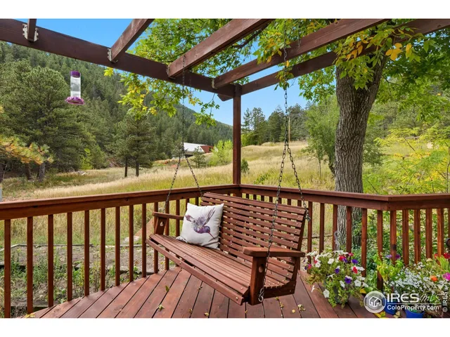 a view of a two chairs in the deck