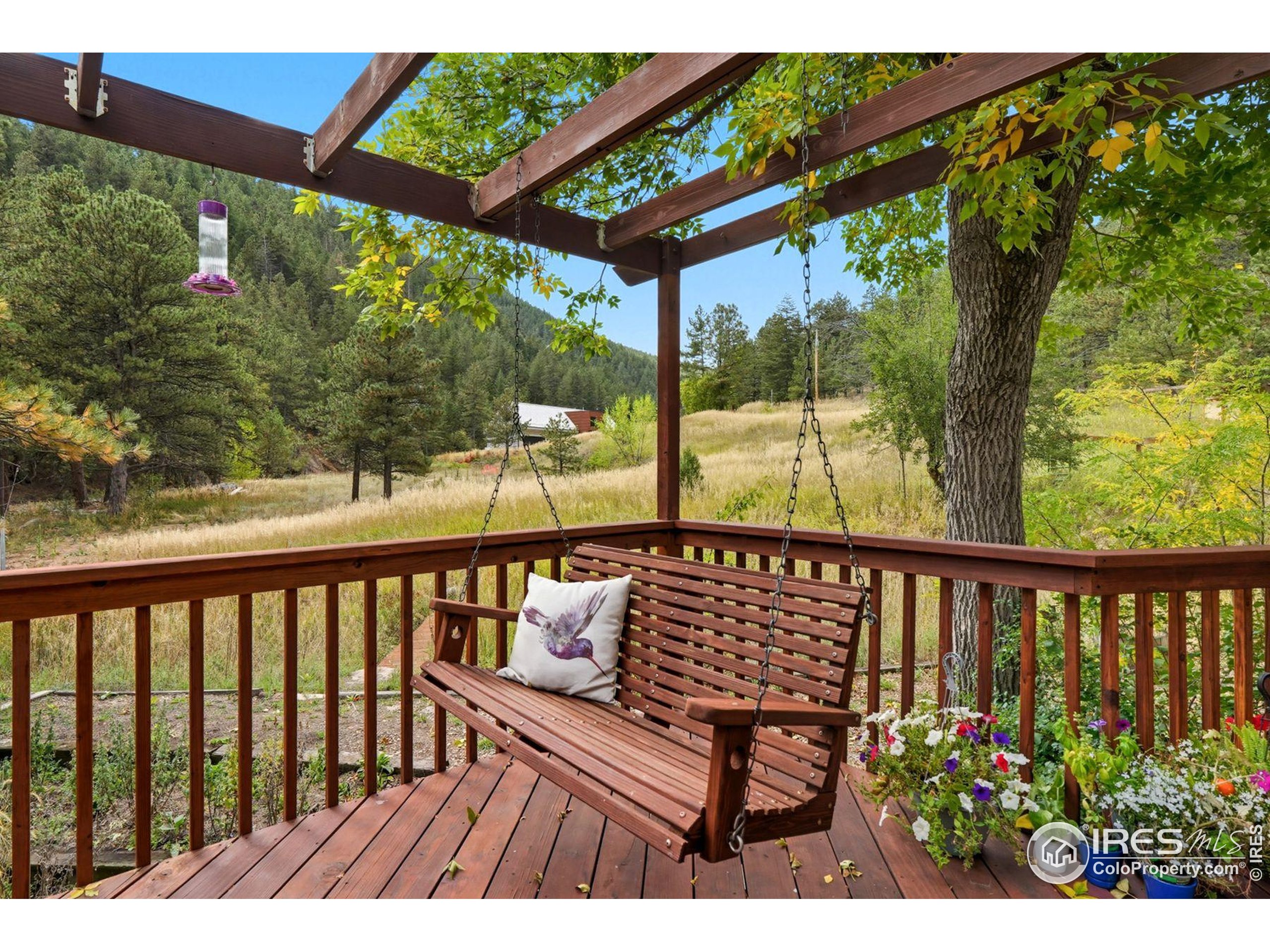 1037 Wagonwheel Gap Road Boulder, CO 80304 - Photo 8 of 43 a view of a two chairs in the deck