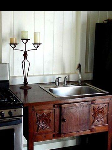 131 Hikiau Road Haiku, HI 96708 - Photo 8 of 27 a kitchen with a sink and a stove