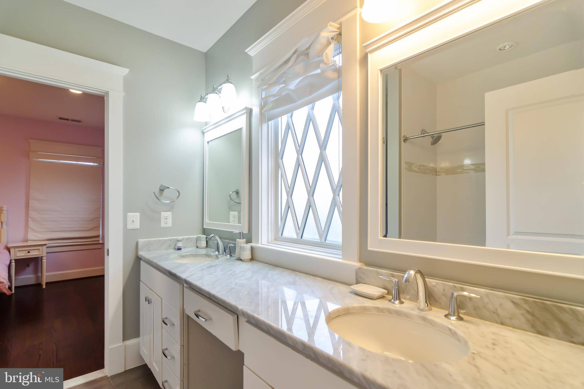 6801 Danforth Street McLean, VA 22101 - Photo 24 of 29 a bathroom with a granite countertop double vanity sink and a mirror
