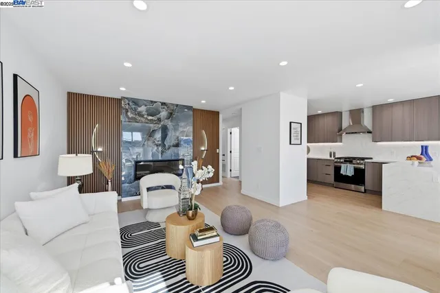 a kitchen with stainless steel appliances a sink a stove and refrigerator