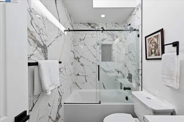 a living room with furniture and a lamp