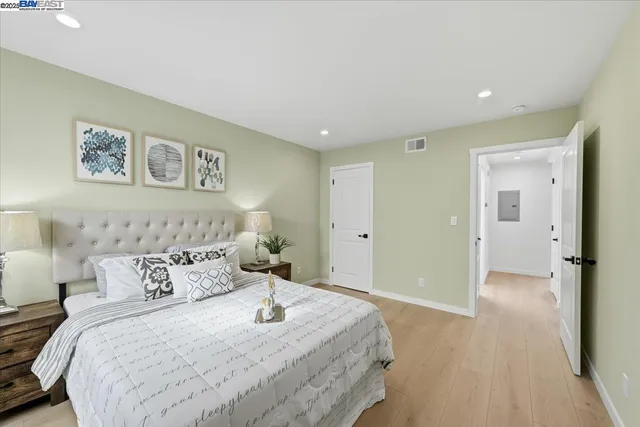 a bathroom with a granite countertop sink toilet a mirror and shower