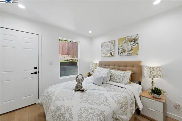 a bathroom with a sink a toilet a mirror and shower