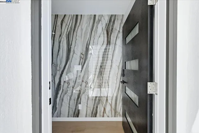 a living room with a fireplace wooden floor and a fireplace