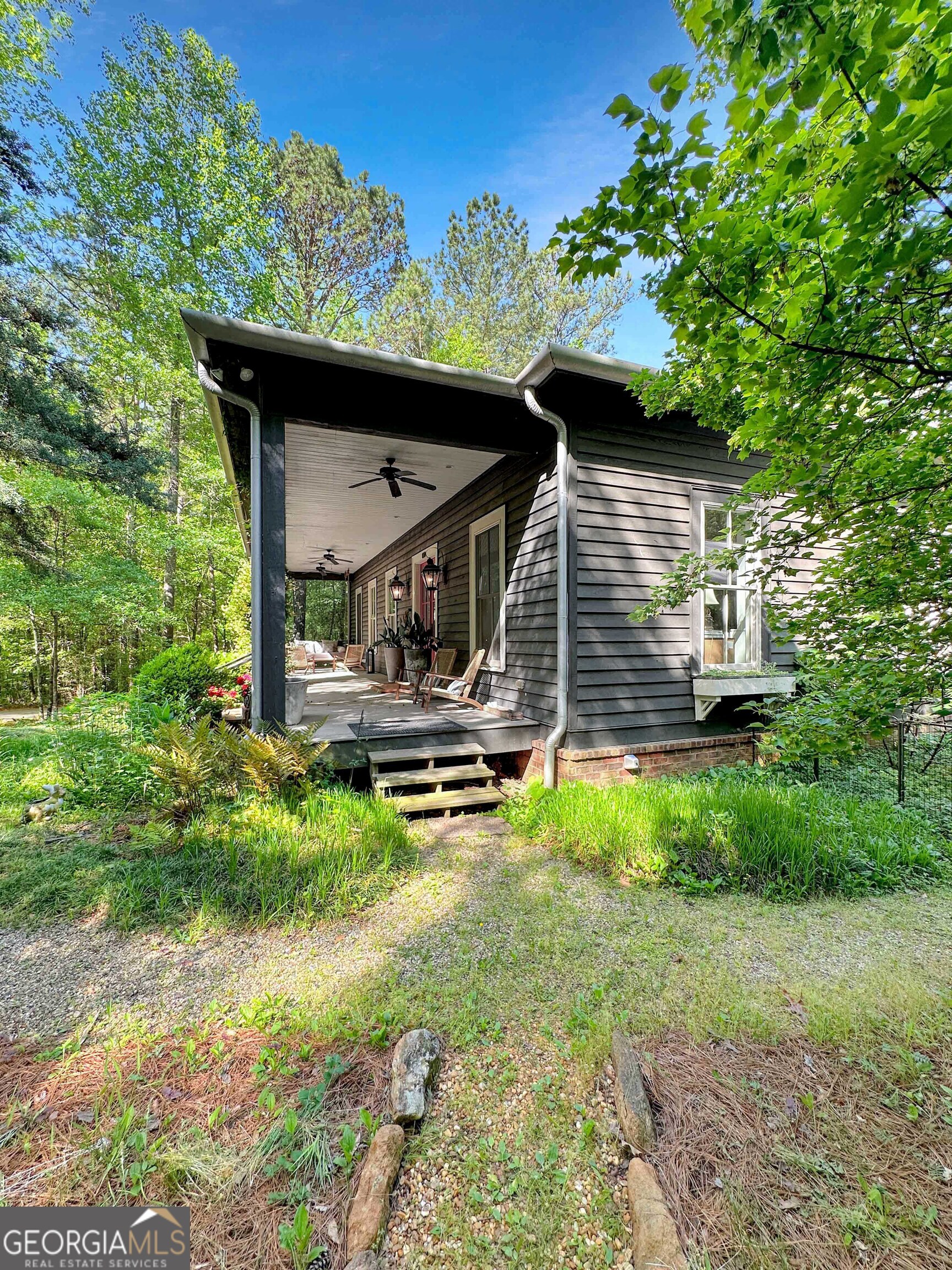 500 Augusta Lane Chattahoochee Hills, GA 30268 - Photo 2 of 49 a house with trees in the background