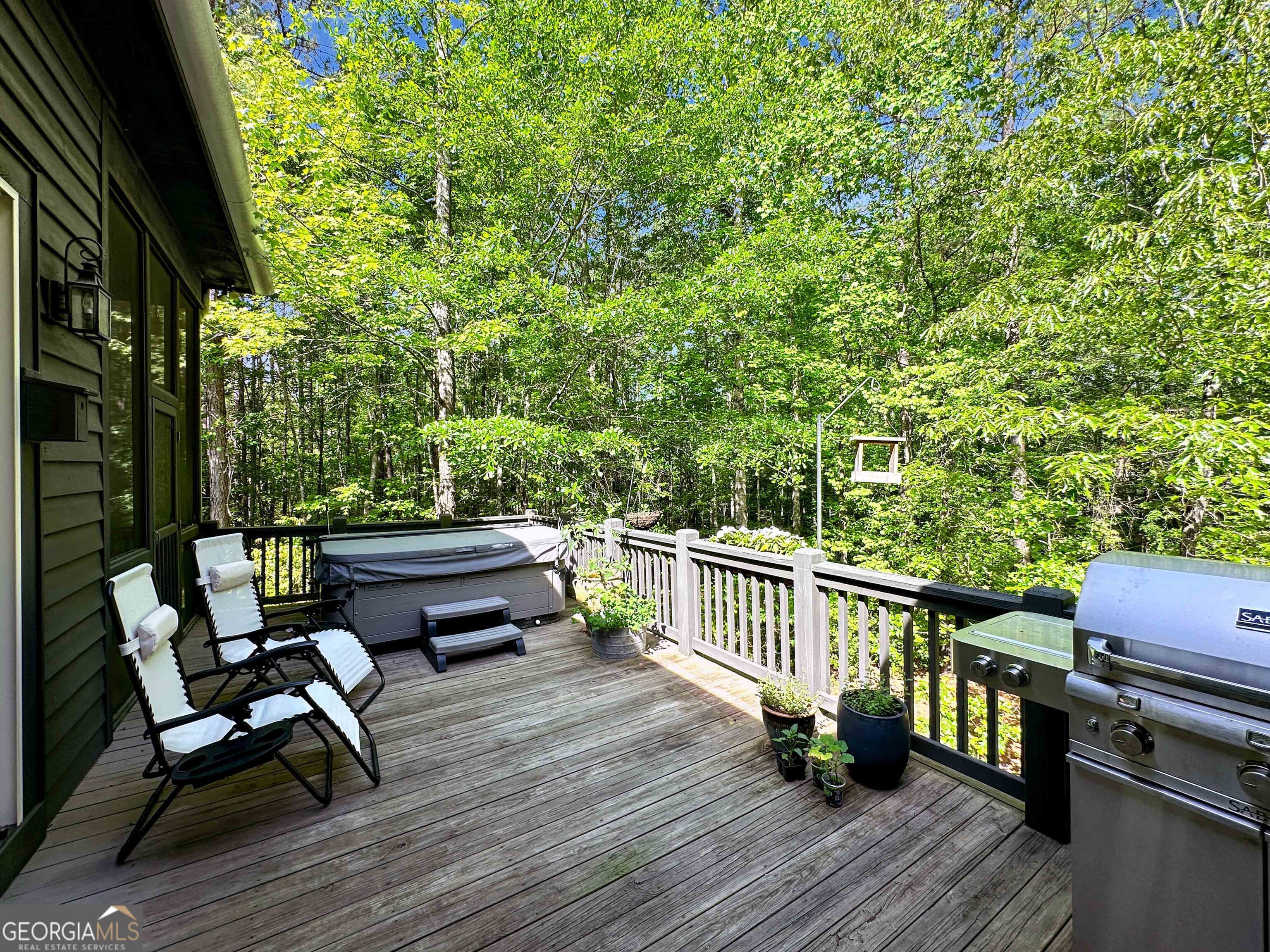 500 Augusta Lane Chattahoochee Hills, GA 30268 - Photo 24 of 49 a view of a wooden chairs on the deck