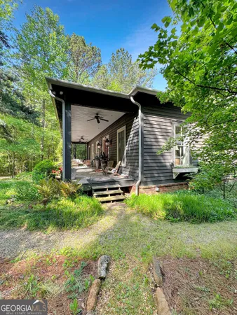 a house with trees in the background