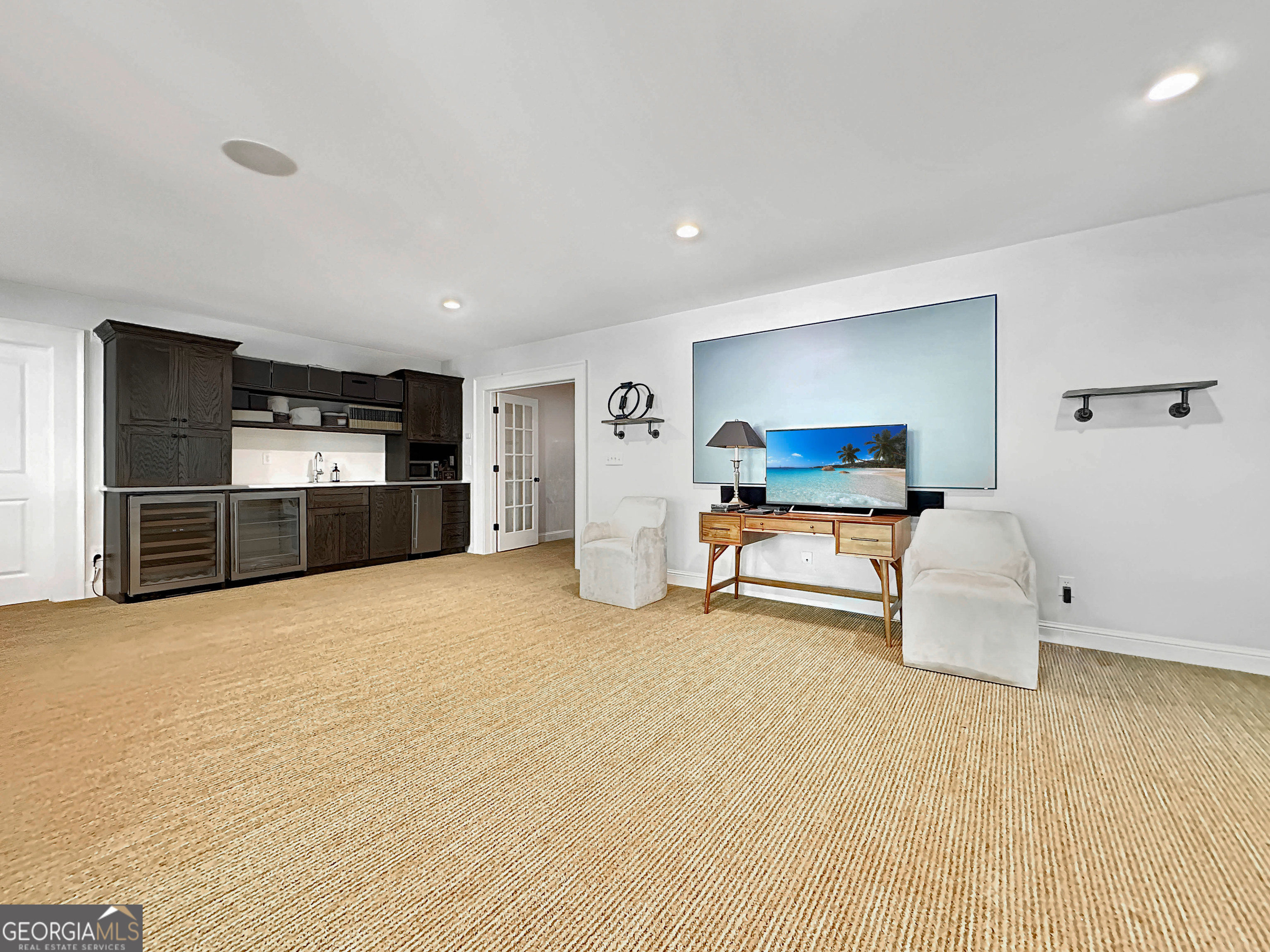 500 Augusta Lane Chattahoochee Hills, GA 30268 - Photo 40 of 49 a room with furniture and a flat screen tv