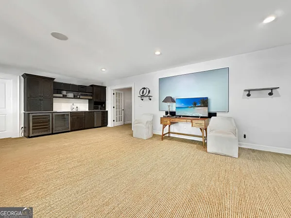 a room with furniture and a flat screen tv