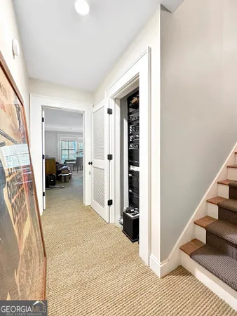 a view of a livingroom with furniture and a bedroom