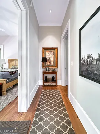 a view of a hallway view with living room and dining room