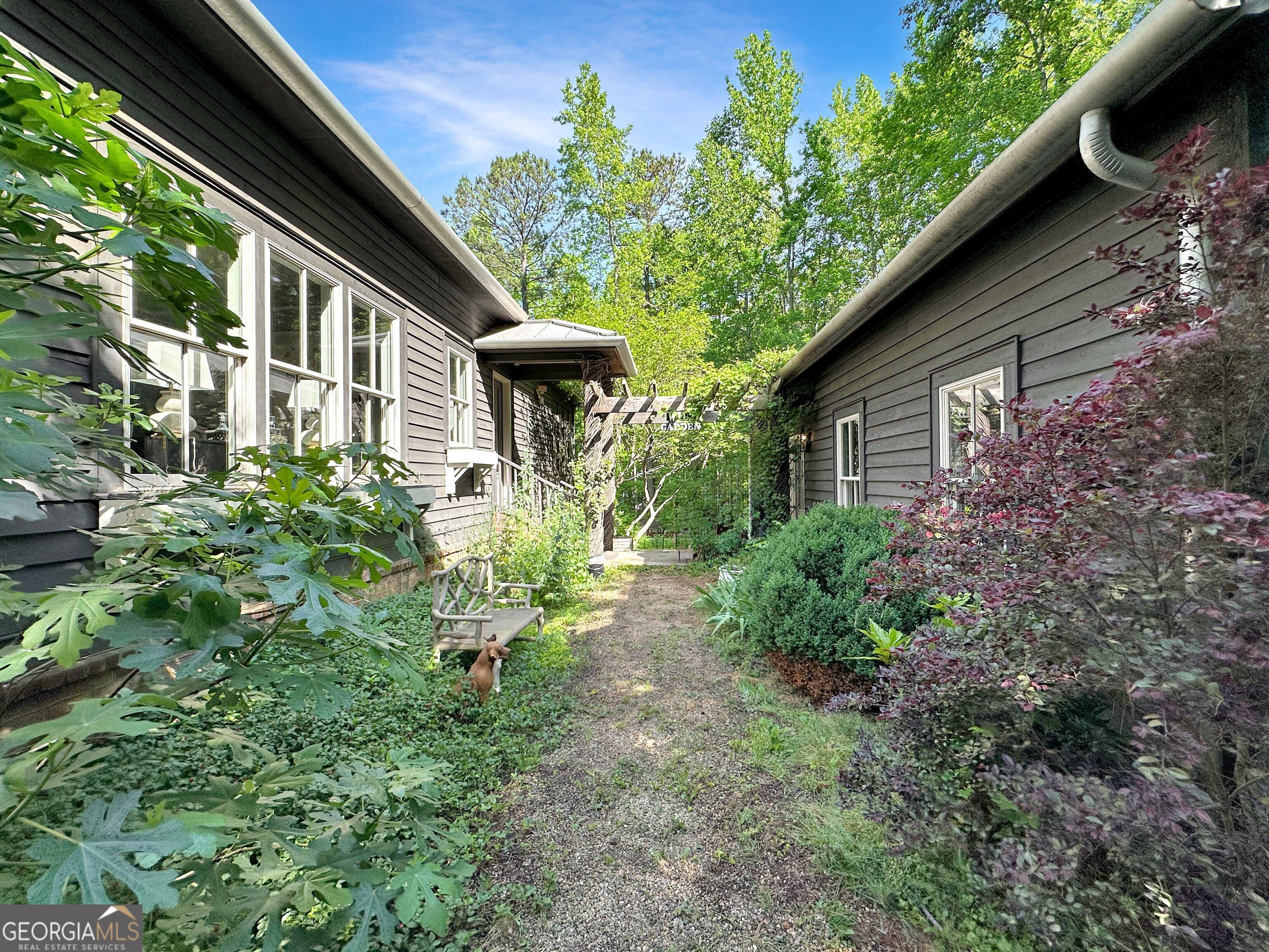 500 Augusta Lane Chattahoochee Hills, GA 30268 - Photo 5 of 49 a small garden in the backyard of a house
