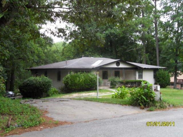 357 Harlan Road Southwest Atlanta, GA 30311 - Photo 1 of 1 a front view of a house with garden