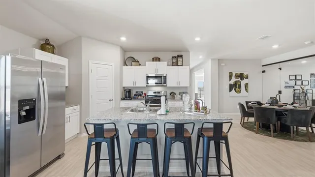 a view of a backyard with a garden and entertaining space