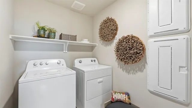 a view of kitchen with kitchen island stainless steel appliances a sink stove and refrigerator