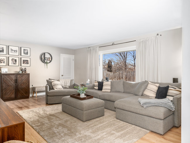 1506 Meadows Road Geneva, IL 60134 - Photo 11 of 33 a living room with furniture and a large window