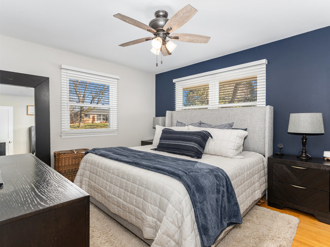 1506 Meadows Road Geneva, IL 60134 - Photo 15 of 33 a bedroom with bed and a chandelier
