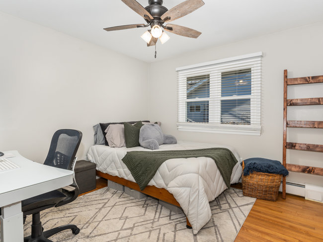 1506 Meadows Road Geneva, IL 60134 - Photo 17 of 33 a bedroom with furniture and wooden floor