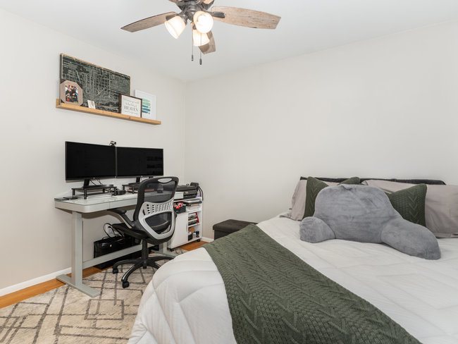 1506 Meadows Road Geneva, IL 60134 - Photo 18 of 33 a bedroom with a bed and a table