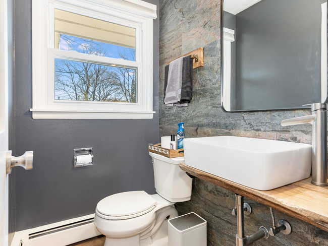 1506 Meadows Road Geneva, IL 60134 - Photo 21 of 33 a bathroom with a sink a toilet and mirror