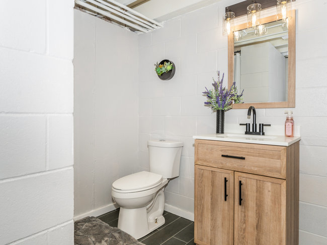 1506 Meadows Road Geneva, IL 60134 - Photo 26 of 33 a bathroom with a toilet sink and mirror