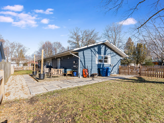 1506 Meadows Road Geneva, IL 60134 - Photo 31 of 33 a front view of a house with a yard outdoor seating and garage