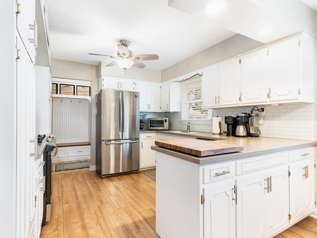 1506 Meadows Road Geneva, IL 60134 - Photo 5 of 33 a kitchen with a stove a refrigerator and a sink