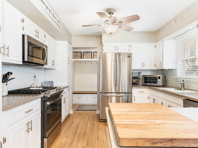 1506 Meadows Road Geneva, IL 60134 - Photo 7 of 33 a kitchen with stainless steel appliances a stove microwave and a refrigerator