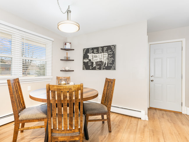 1506 Meadows Road Geneva, IL 60134 - Photo 8 of 33 a dining room with furniture and wooden floor