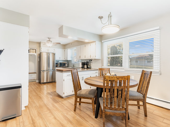 1506 Meadows Road Geneva, IL 60134 - Photo 10 of 33 a view of a dining room with furniture and wooden floor