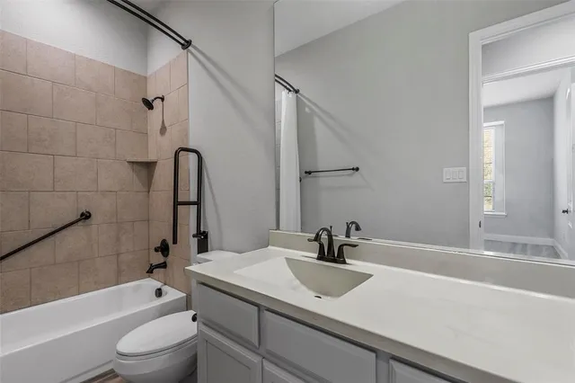 a bathroom with a sink a toilet and a tub