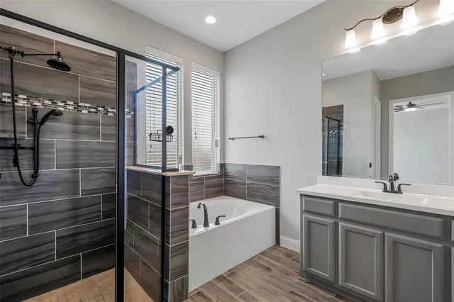 a bathroom with a bathtub and a sink