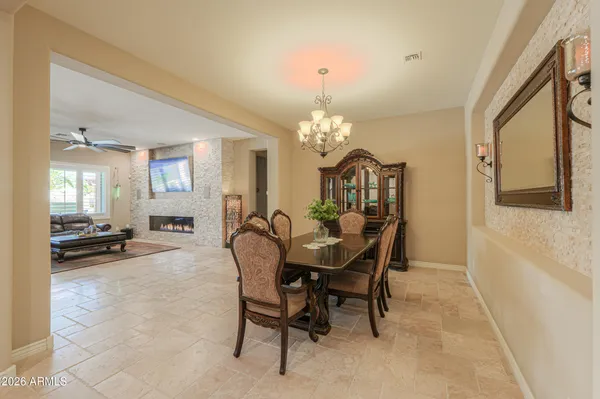 a living room with furniture wooden floor and a window