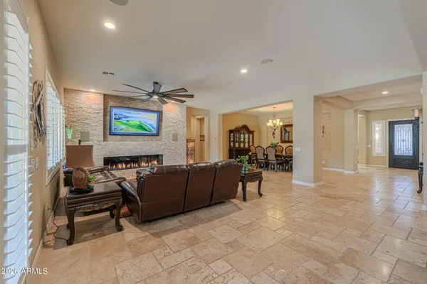 a bedroom with a bed and a ceiling fan