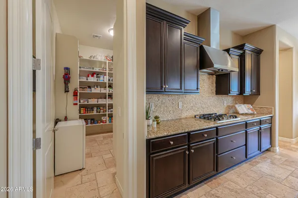 a view of walk in closet with clothes