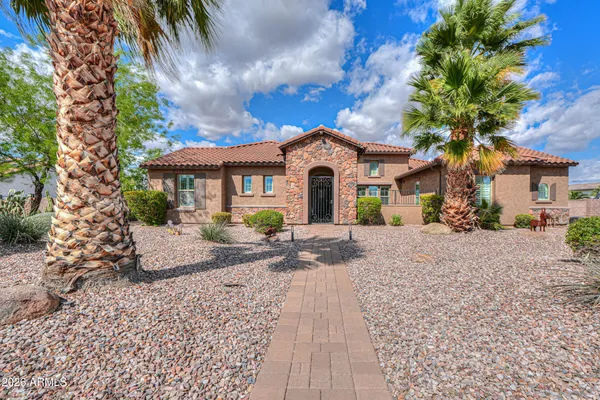 a living room with furniture flowerpot and a chandelier