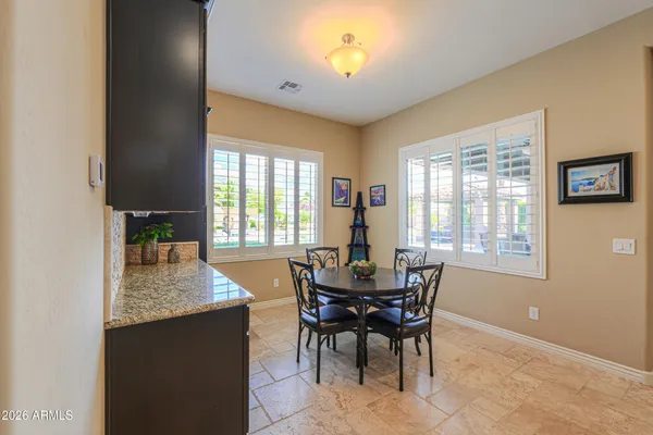 a bedroom with furniture and a potted plant