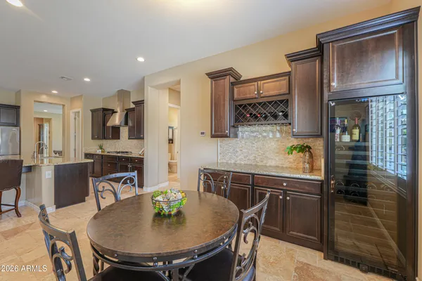 a view of a swimming pool with outdoor seating