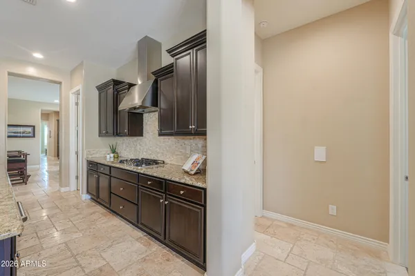 a view of a house with a swimming pool and sitting area