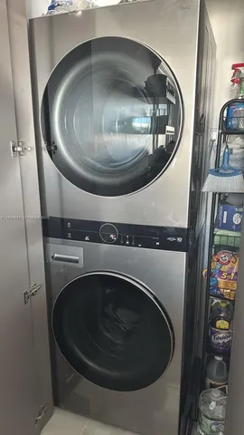 a bed sitting in a bedroom next to a bathroom