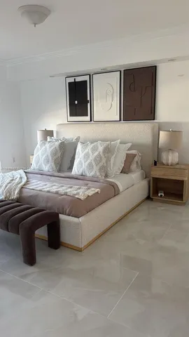 a bedroom with a bed and lamp