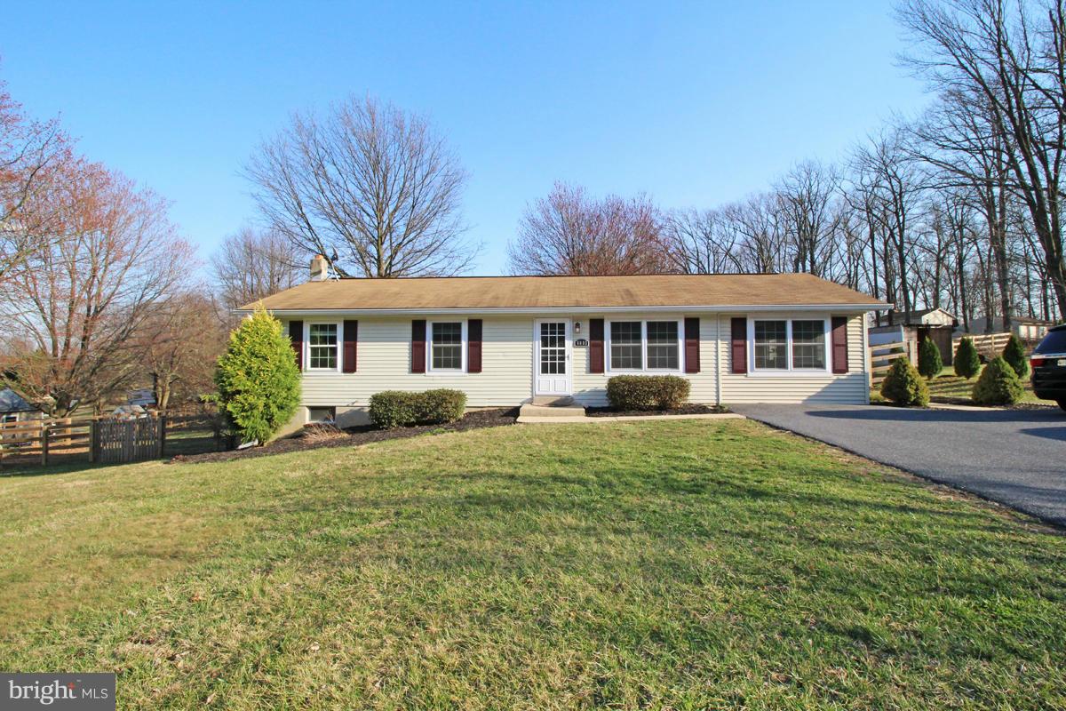 6603 South Clifton Road Frederick, MD 21703 - Photo 2 of 21 a front view of a house with a yard