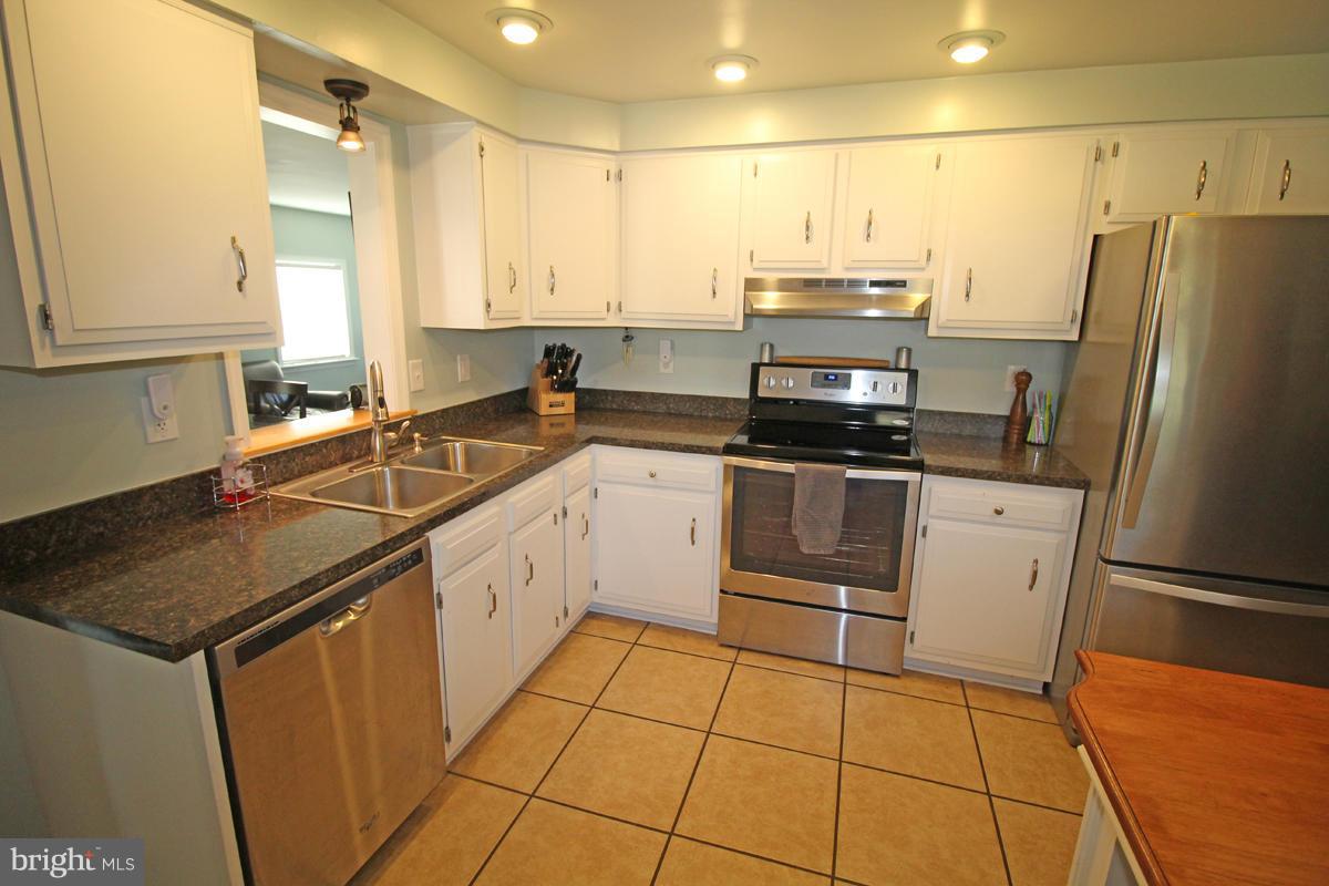6603 South Clifton Road Frederick, MD 21703 - Photo 11 of 21 a kitchen with a sink appliances and cabinets